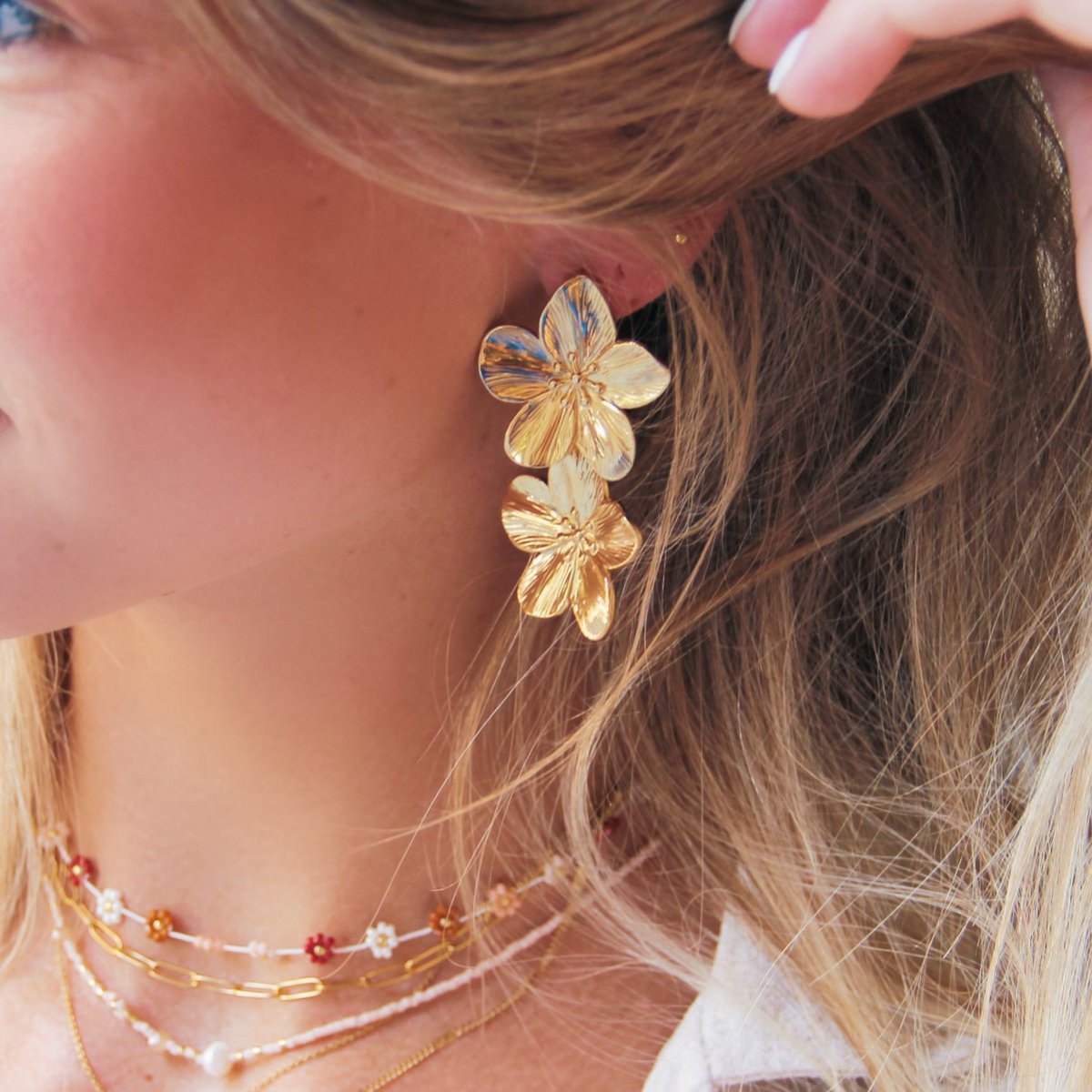 RVS statement oorbel 2 bloemen - goud